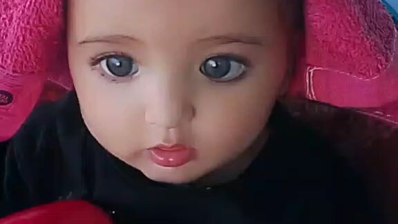 baby girl playing cap