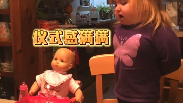 Cute kid celebrates her doll’s birthday…