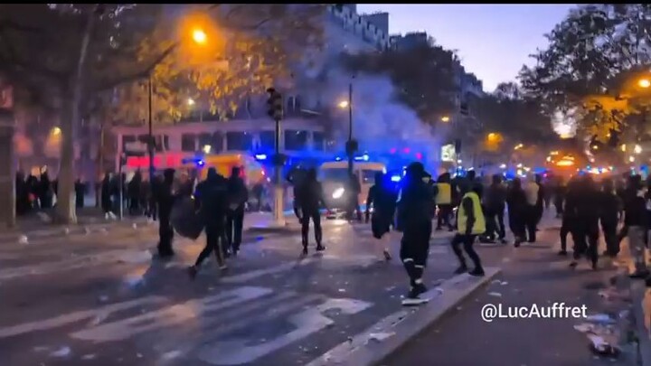 Paris police fleeing from rioters