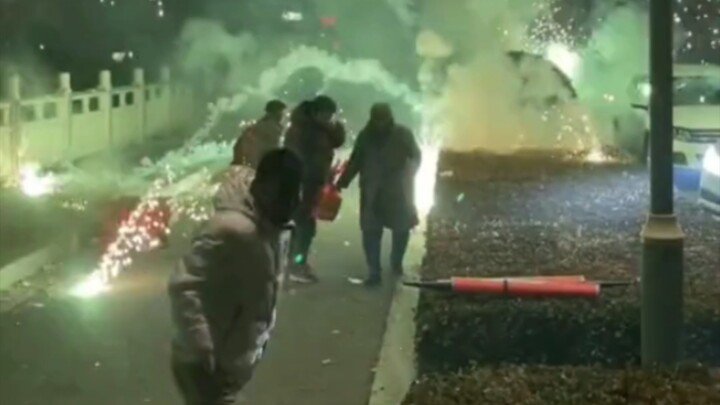 The fireworks hadn’t even finished when an elderly woman went to grab a cardboard box, accidentally 