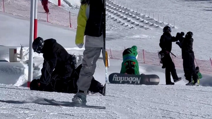 Dua pria saling baku hantam di area ski, boneka katak menyaksikan seluruh kejadian dan mendekat untu