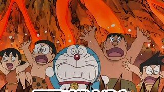 Doraemon: Trapped in a volcano in the Stone Age, Suneo becomes a god with his camera and faces many 