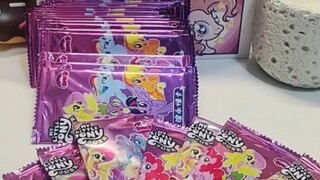 Aku tertawa terbahak-bahak saat geram dengan kartu My Little Pony bajakan itu.