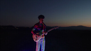 [Music] Gentle boy Jaden is playing guitar in the yard.