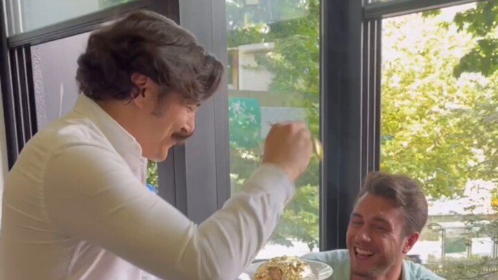 Smiling and joking while eating during the defense