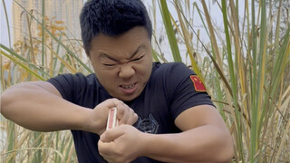 Kung Fu madman performs bare-handed poker tearing