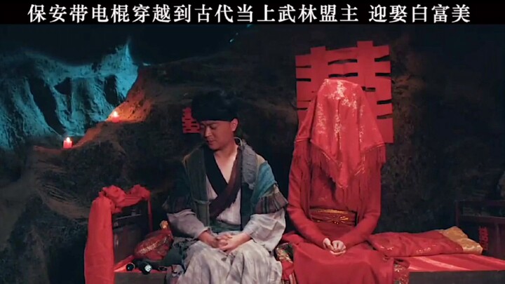 A security guard wielding an electric baton time-travels to ancient times, becomes the martial arts 