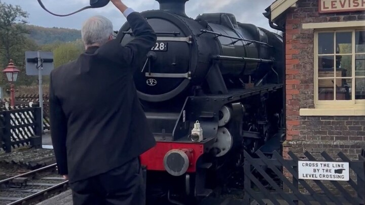 Why Do Old-Style Trains Hand Off a Ring When Pulling Into the Station?