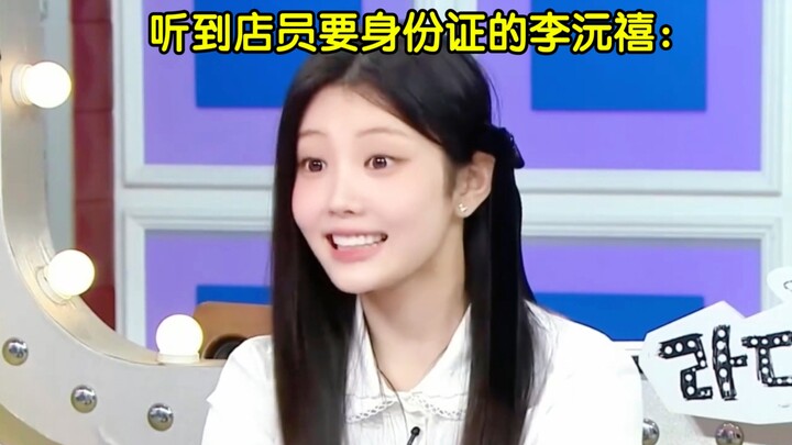 A group of adults watches a little cutie pretending to be grown-up: