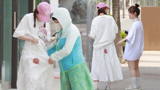 A girl accidentally stained her skirt during her period, and someone tied his clothes around her wai