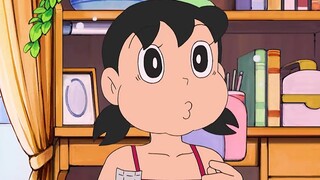 Doraemon: Nobita dikerjai oleh bocah harimau gemuk, dan Dora kecil membalas dengan pistol mainan.