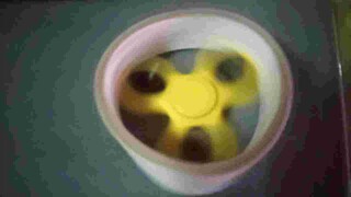 Fidget spinner in a tape roll