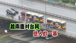 A Vietnamese truck driver shielded a motorcyclist from the typhoon on a bridge