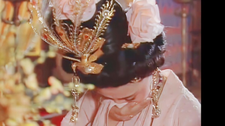 Adorned with a pink flower in her hair yet far from vulgar—such a classic beauty is rarely seen thes