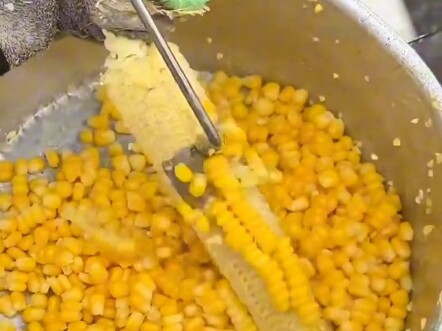 Stress-relieving corn husking