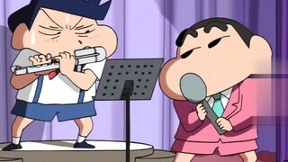 Shin-chan appears at the wedding and plays classic songs with Kazama