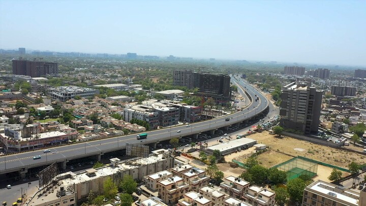 Scenic view of a busy flyover with vehicles commuting from one end to the other