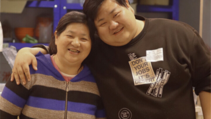 A mother holds her family together—though life is tough, she still does her small part to bring a li