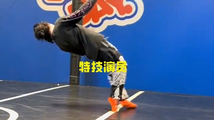 How do stunt performers simulate being knocked flying by a punch?