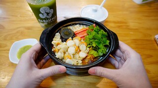 Trying delicious crab soup with crab meat, century egg and scallops