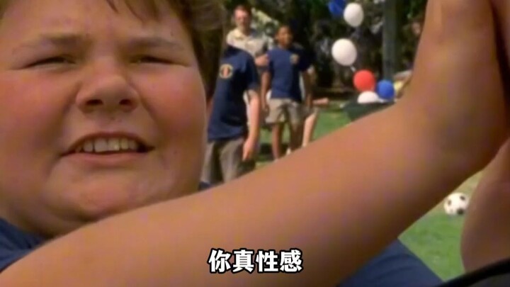 A chubby kid touches a beautiful girl's face.