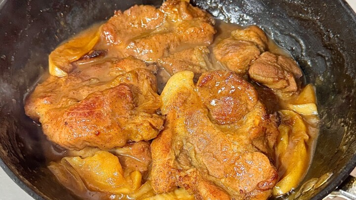 Apples with pork chops? The apples add a fruity aroma and help tenderize the chops—so delicious!