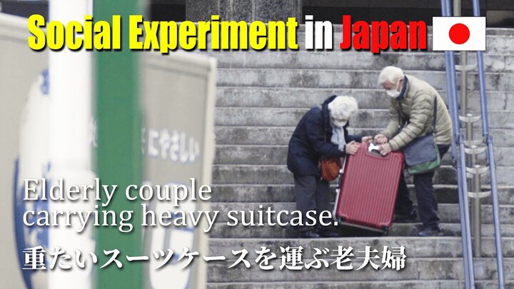 Elderly couple carrying heavy suitcases. | Social Experiment in Japan