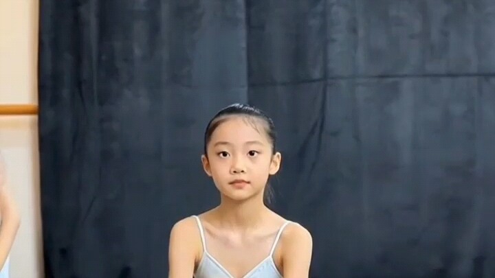 Little Girl Taking Her Art Exam Practices Deep Squats