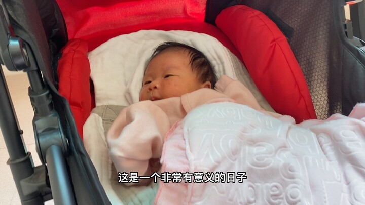 On the day his daughter turned one month old, what was her dad doing?