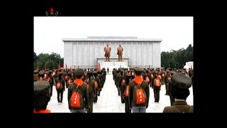Caravana das crianças escolares pelos locais de batalha revolucionária da zona do monte Paektu
