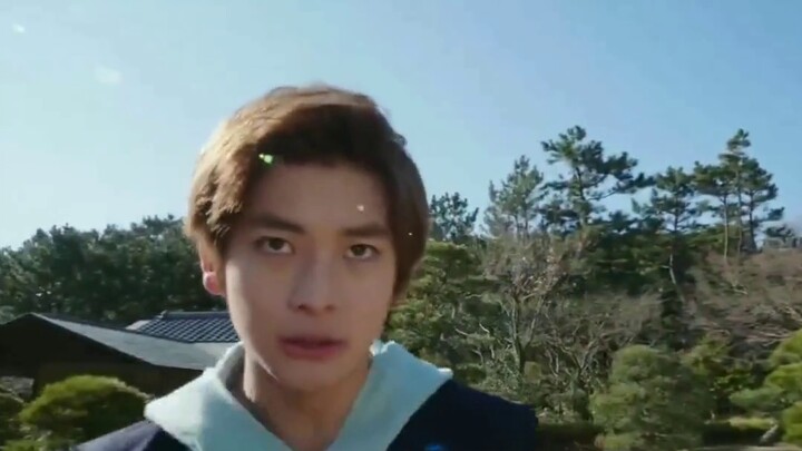 Kamen Rider 01 is currently transformed into a locust form