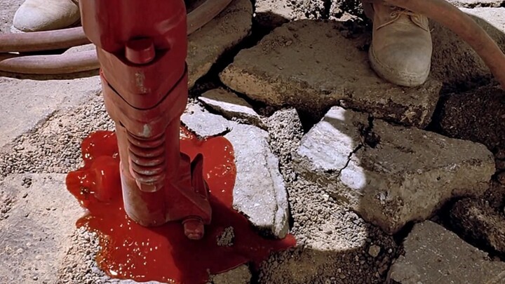 Workers were paving the road when a scream suddenly erupted from beneath the jackhammer, and a pool 