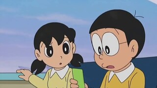 Doraemon: Fat Tiger wakes up to find a baby next to him, and has no choice but to take care of the b