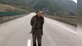 An old man stood in a traffic jam on the highway with an ax in his hand, making it impossible for ma