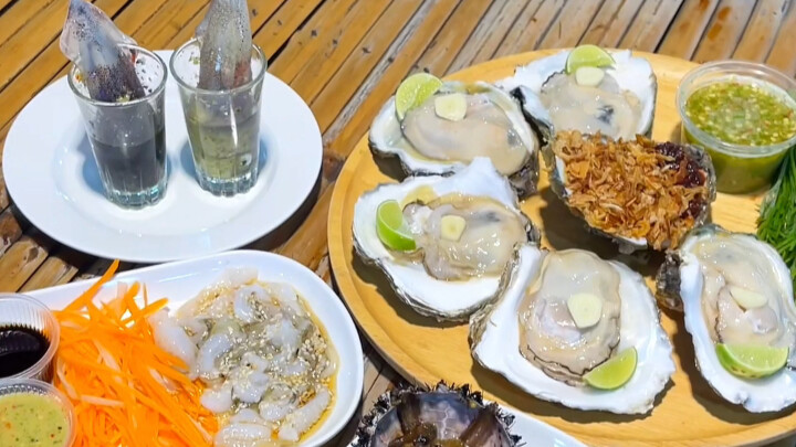 A Lai Ma: Thai-style sashimi, jumping squid, and wasabi octopus—freshly grilled at a night-market st