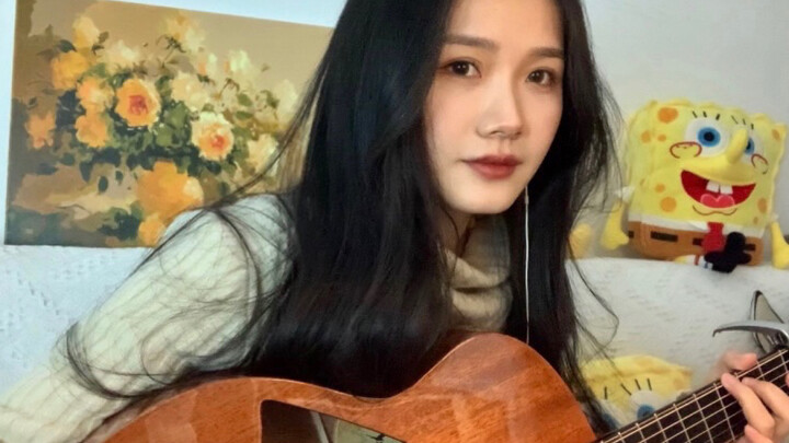 Cover the song "Qian Si Xi" playing the guitar