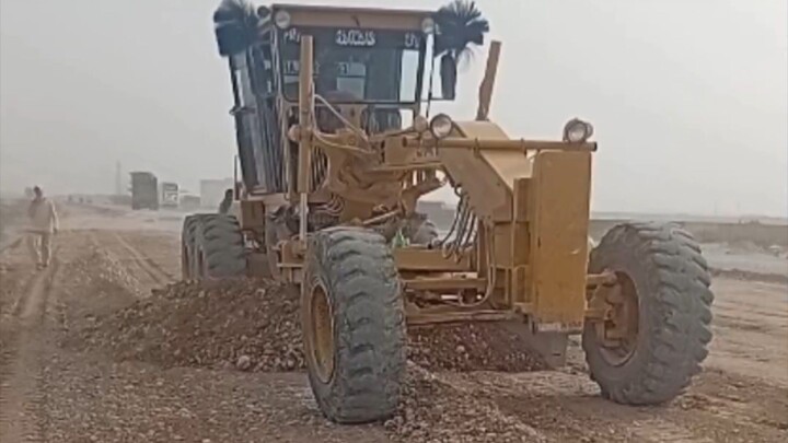 grading of a subbase material havey Machinery caterpillar grader hard working in road #shorts Pakist