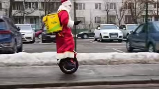 Ded Moroz on an electric unicycle