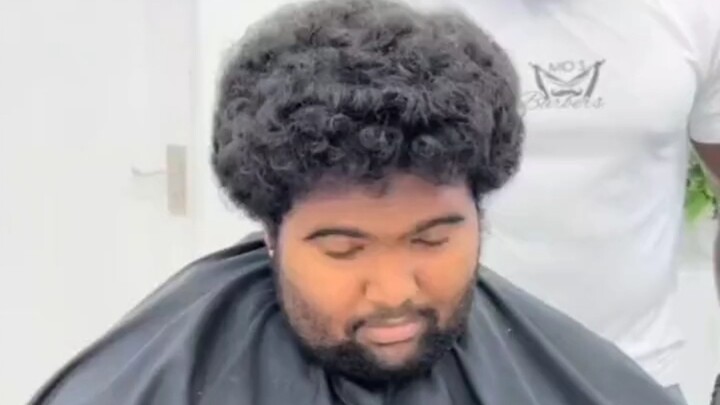 The iconic scene of walking out of the barbershop with a smile