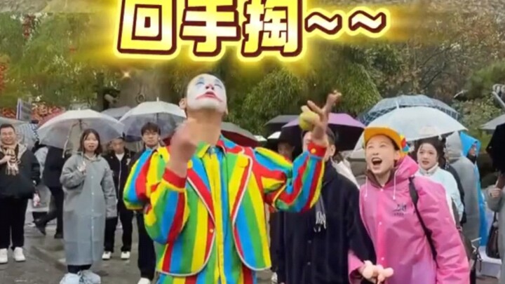 A clown from Wanshi Mountain gets thoroughly outshined by performers from the National Acrobatic Tro