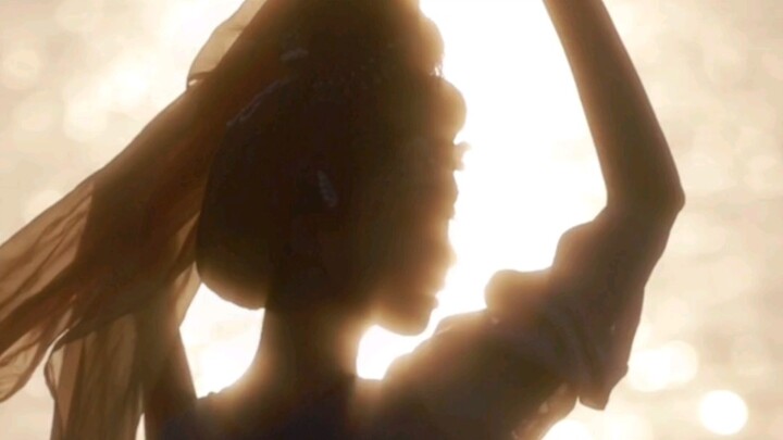 Ripples shimmer like scattered gold, still shadows sink like a flawless jade disc.