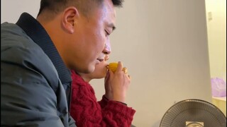 Mom and Dad watch Sasha eat sweet potatoes