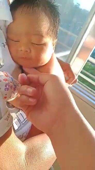 baby  sunning