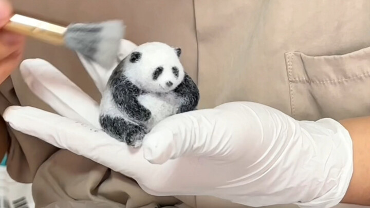 My husband turned a giant panda into a squishy toy?! It’s so realistic!