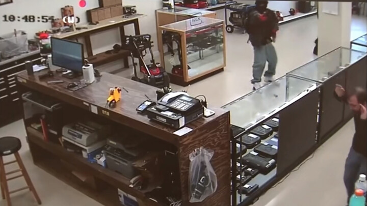 Two "Visitors" of a Gun Shop in America
