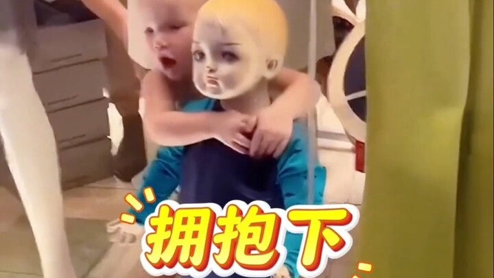 Cute kid hugs and kisses the male mannequin in the shop window—about to lose it! So adorable…