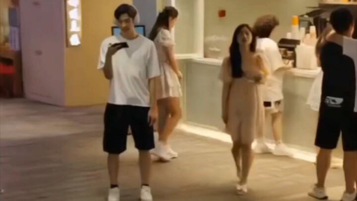 “Scrolling on phones, queuing while scrolling on phones”