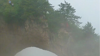 A masterpiece of nature, resembling a colossal mountain gate spanning across the valley.