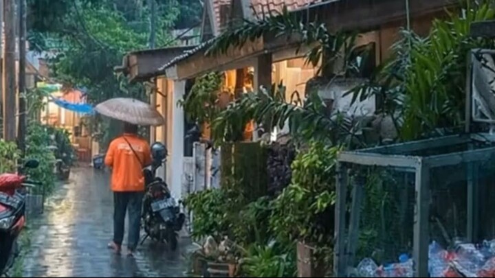 POV Rainy Evening in a Small Jakarta Alley