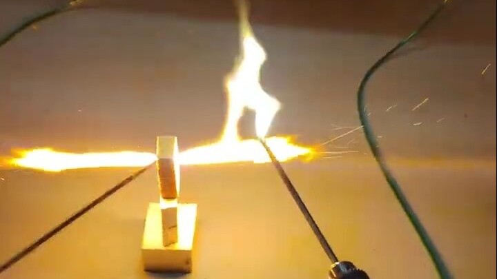 High voltage arcs through 2 cm of dry wood—28 kV, 875 mA discharge #shortcircuit #highvoltage